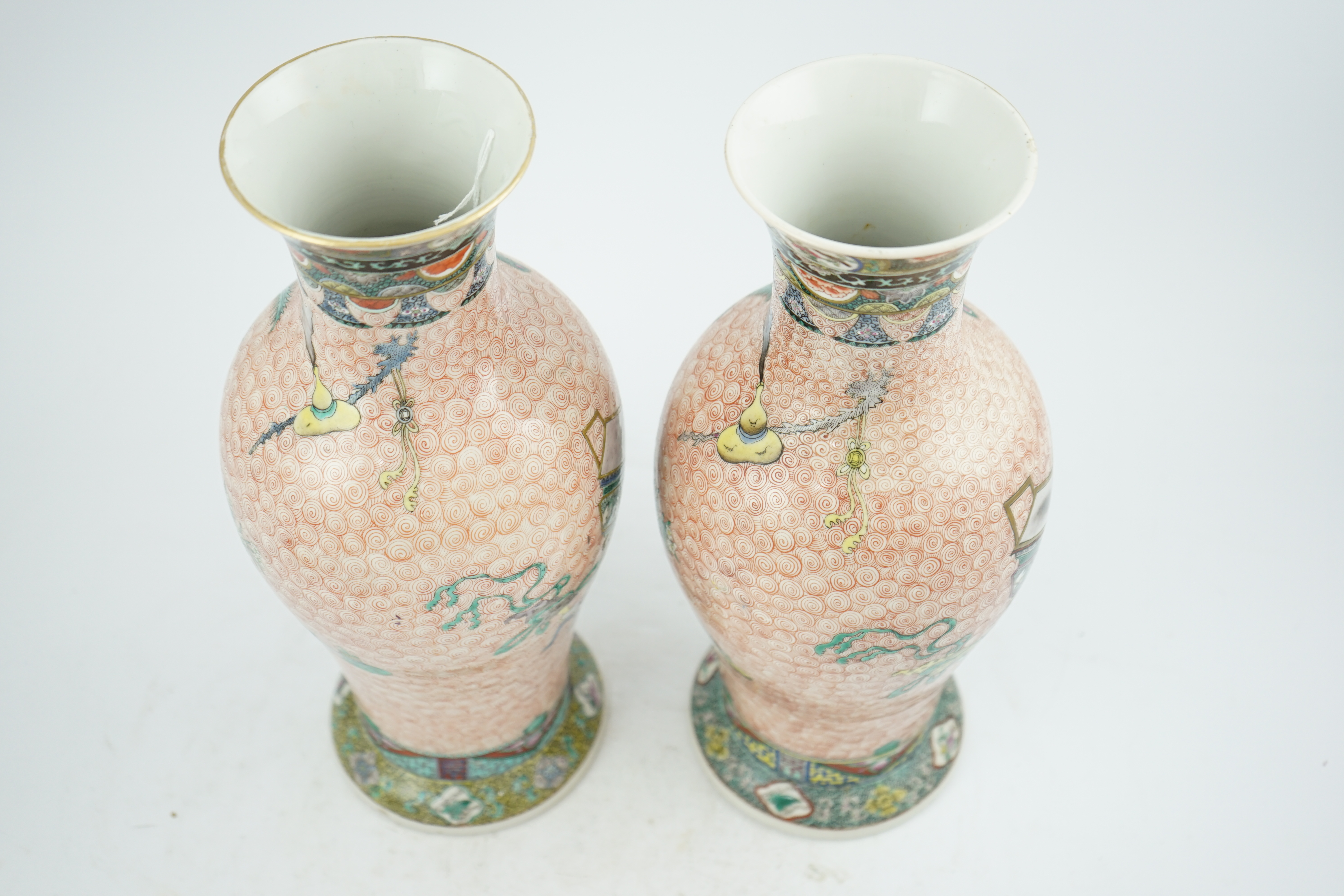 A near pair of Chinese famille rose ‘Hundred Antiques’ baluster vases, Kangxi mark, early 20th century